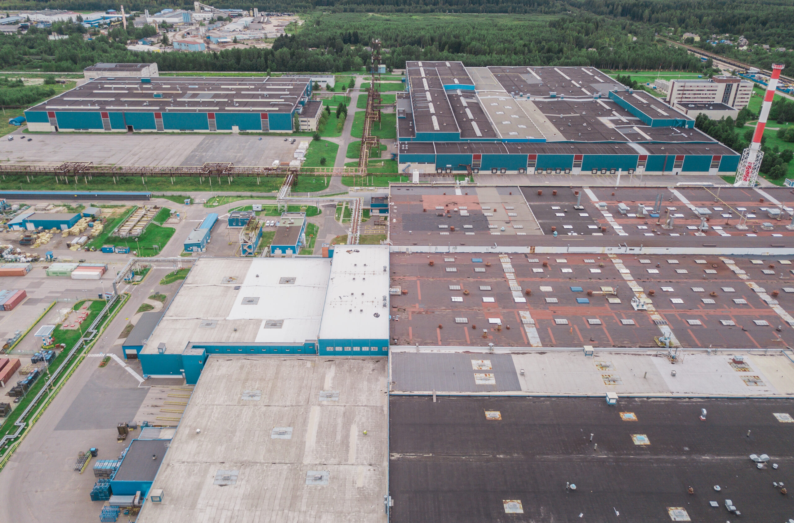 Aerial view of huge industrial area near forest